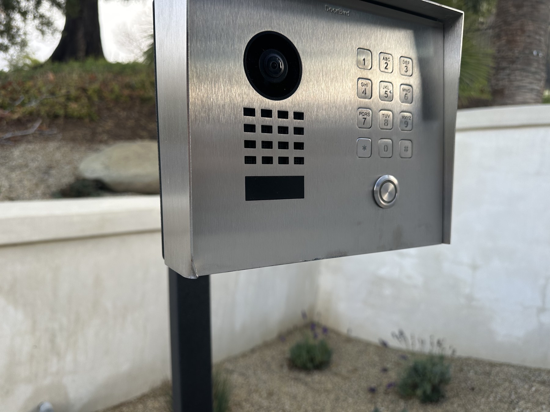 Property-entry video intercom mounted on a freestanding post